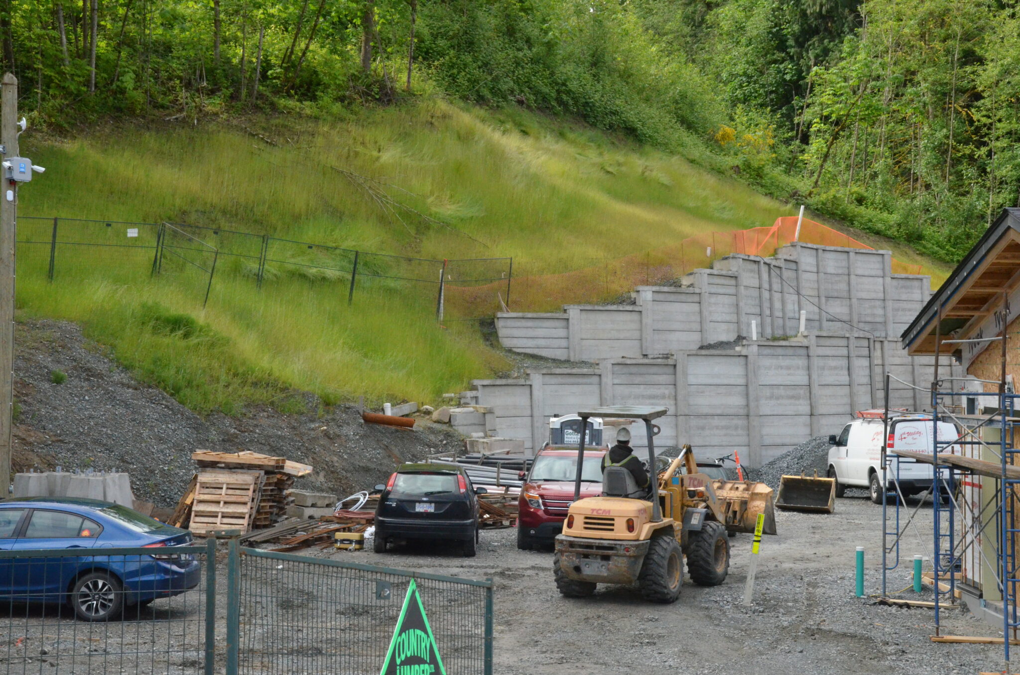 Slope Stabilization and Retaining Wall Construction At The Rear Of A Private Business